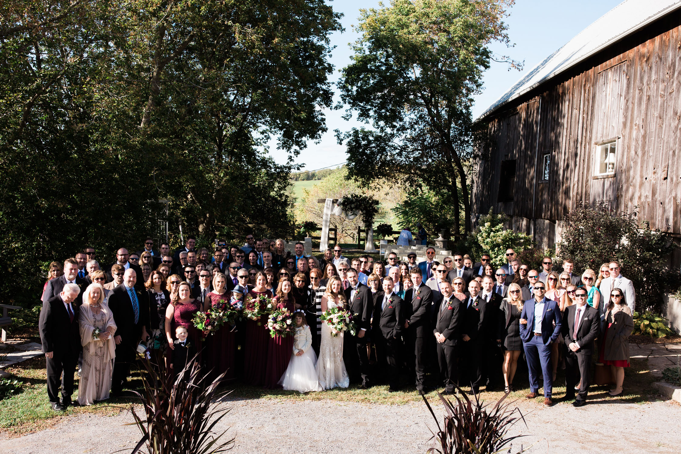 The entire wedding party and all the guests gather together for photo op!