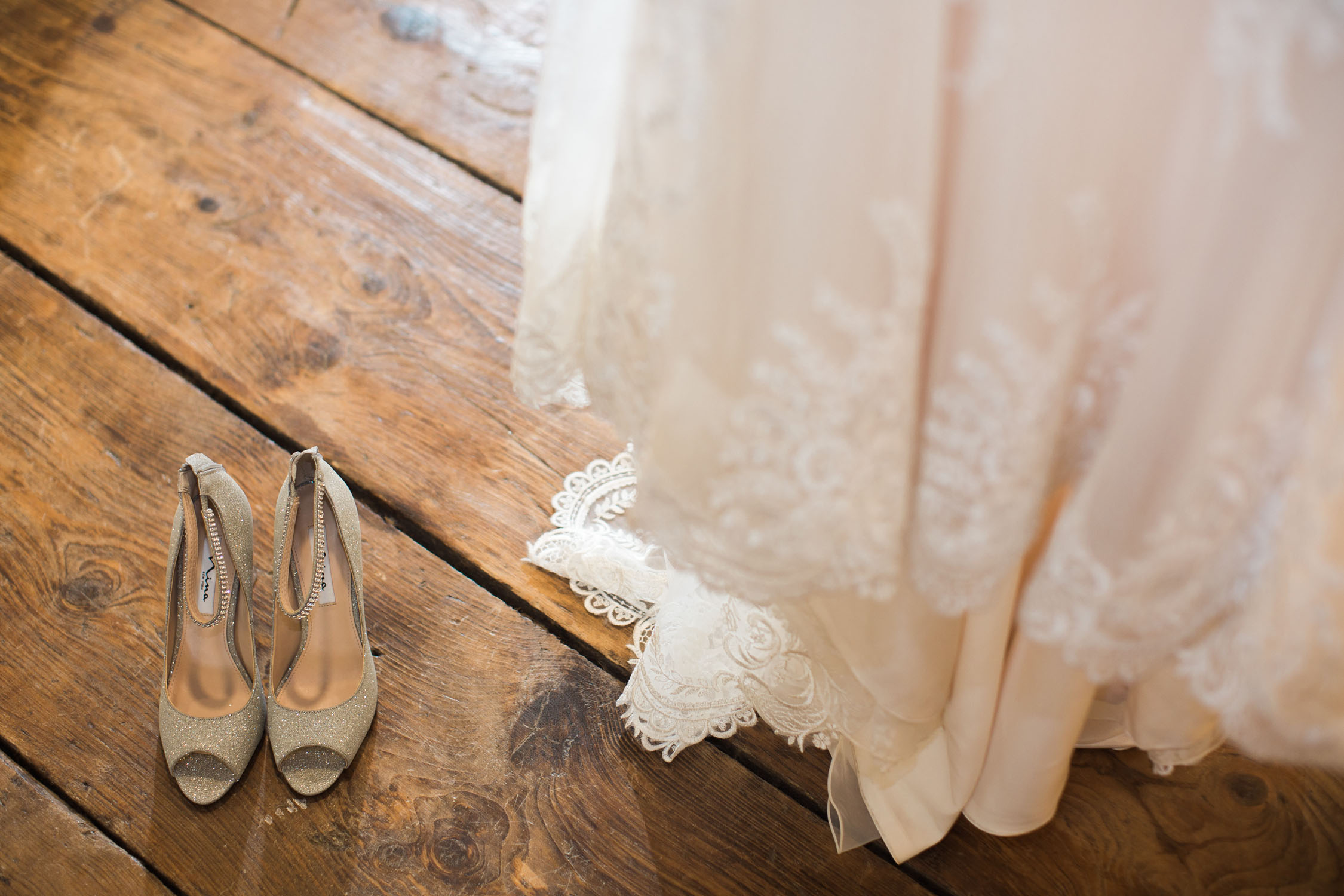 Picture showing shoes and wedding dress.