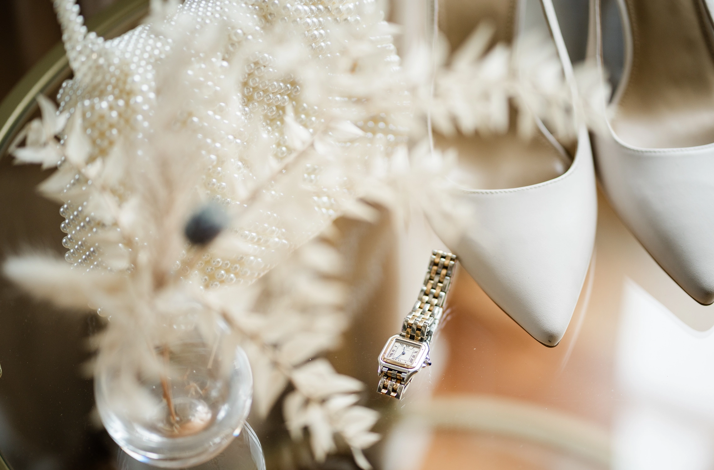 Bridal details in window light at Compass Rose Suites in Prince Edward County.