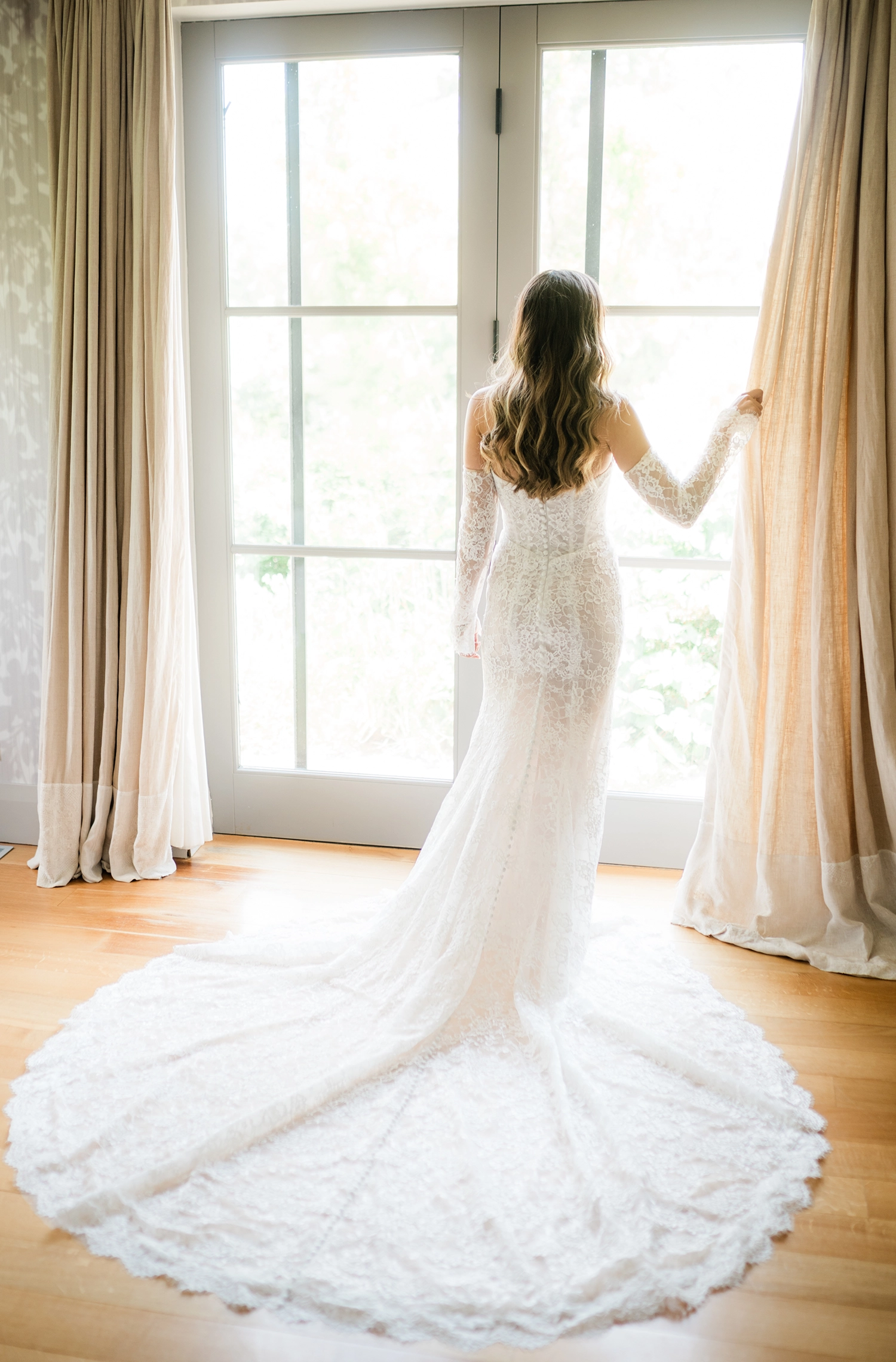 Compass Rose wedding photographer capturing a bridal portrait in soft window light.