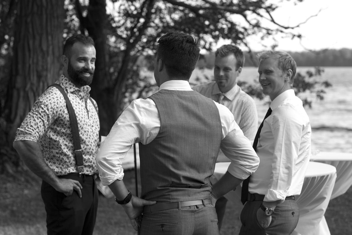 Groom with friends at lake on the mountain in picton 